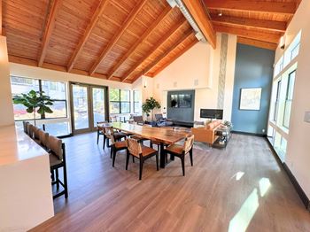 A dining room with a wooden table and chairs at The Lakes in WA 98007
